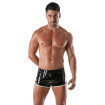 man wearing black and white vinyl fetish shorts from front with wide shot